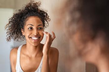 Ulta CEO: Consumer Spending Is Cooling Off. Here's What That Means for the Beauty Stock: https://g.foolcdn.com/editorial/images/779662/young-woman-standing-in-front-of-mirror-applying-face-cream.jpg