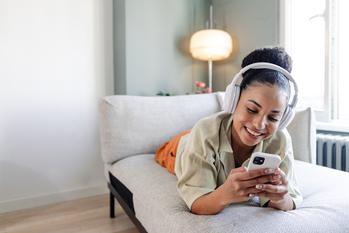 Why Snap Stock Topped the Market Today: https://g.foolcdn.com/editorial/images/791210/happy-person-using-headphones-and-a-phone-while-lying-on-a-couch.jpg