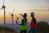 3 Dividend-Paying Companies That Are Investing in the Energy Transition: https://g.foolcdn.com/editorial/images/708153/2-workers-wearing-hard-hats-point-at-a-row-of-wind-turbines-at-sunset.jpg