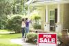 Buy Now or Wait a Year? What Home Buyers Should Do to Avoid Making a Big Mistake: https://g.foolcdn.com/editorial/images/702042/couple-standing-outside-house-for-sale-gettyimages-1329584004.jpg