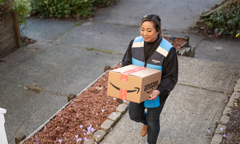 Should Investors Buy Amazon Stock Today?: https://g.foolcdn.com/editorial/images/775321/amazon-flex-driver-delivering-package-to-door-step-1.png