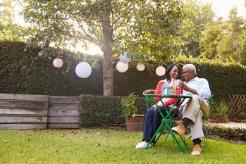 Retiring In Another State? Don't Forget to Plan for These 3 Things: https://g.foolcdn.com/editorial/images/777607/mature-couple-relaxing-drinking-wine-together-in-their-backyard.jpg