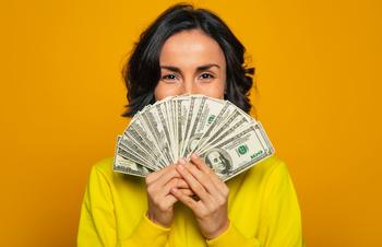 Becoming an HSA Millionaire: Is It Possible?: https://g.foolcdn.com/editorial/images/692276/woman-with-yellow-shirt-holding-money.jpg