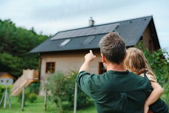 Why Canadian Solar Stock Tanked by 12% on Tuesday: https://g.foolcdn.com/editorial/images/745090/adult-with-child-in-arms-pointing-to-a-house-with-solar-panels-on-its-roof.jpg