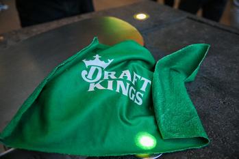 1 Growth Stock Wall Street Might Be Sleeping on, but I'm Not: https://g.foolcdn.com/editorial/images/783045/draft_kings_logo_on_towel_dkng.jpg