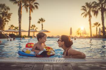 Why Marriott International Stock Inched Higher Today: https://g.foolcdn.com/editorial/images/743139/adult-and-child-frolicking-in-a-pool.jpg