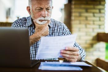 Worried That Healthcare Costs Will Wreck Your Retirement? Here's What to Do.: https://g.foolcdn.com/editorial/images/756667/older-man-serious-looking-at-document_gettyimages-1345284718.jpg