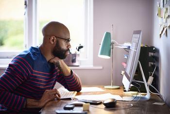 Can Your IRA Make You a Millionaire?: https://g.foolcdn.com/editorial/images/771465/person-staring-at-computer-screen.jpg