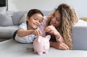 2 Top Dividend Stocks That Could Help Set You Up for Life: https://g.foolcdn.com/editorial/images/744617/a-mother-and-child-putting-coins-in-a-piggy-bank.jpg