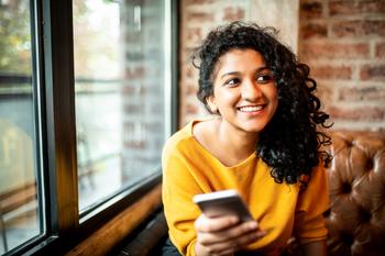 Apple Stock at $200: Time to Buy?: https://g.foolcdn.com/editorial/images/758410/smiling-person-with-phone.jpg