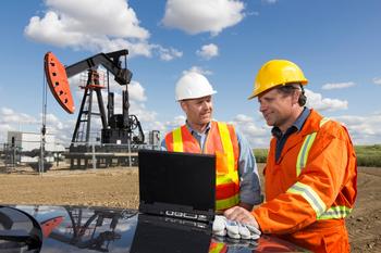 2 High Yield Energy Stocks You Can Hold for the Rest of Your Life: https://g.foolcdn.com/editorial/images/695245/two-oil-workers-using-a-laptop-in-front-of-an-oil-rig.jpg