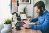 Why Shopify Stock Soared This Week: https://g.foolcdn.com/editorial/images/731189/bearded-person-at-desk-by-computer-taking-notes.jpg