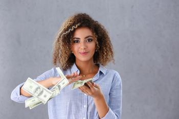 1 AI Stock to Buy and Forget: https://g.foolcdn.com/editorial/images/751549/young-woman-making-it-rain-100-dollar-bills-money-cash-rich-poc.jpg