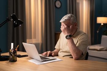 Will Burnout at Work Lead You to an Early Retirement?: https://g.foolcdn.com/editorial/images/771184/older-man-laptop-covering-face-gettyimages-1365842361.jpg