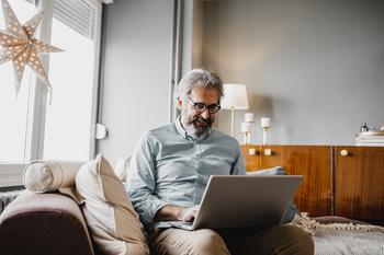 Want More Money Out of Social Security? 3 Things to Do Before You Retire: https://g.foolcdn.com/editorial/images/756971/older-man-smiling-laptop_gettyimages-1214453764.jpg