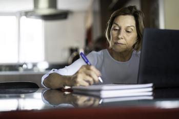 These 3 Mistakes Could Slash Your Retirement Income: https://g.foolcdn.com/editorial/images/717041/older-woman-taking-notes-laptop-gettyimages-1143057831.jpg