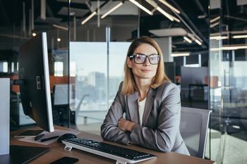 Here's Why I'm Not Worried About Social Security Cuts: https://g.foolcdn.com/editorial/images/735714/woman-business-suit-desk-gettyimages-1365410526.jpg