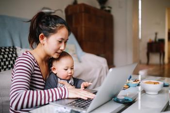 Here's What Pausing Retirement Savings for a Decade Might Cost You: https://g.foolcdn.com/editorial/images/738816/mom-laptop-holding-baby-gettyimages-1077259686.jpg