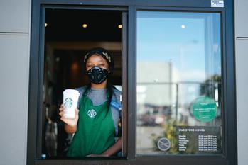 Should You Buy This Stock for Growing Passive Income?: https://g.foolcdn.com/editorial/images/698542/starbucks-stores-reopening.jpg
