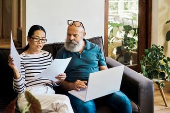 Seniors Paid $50.7 Billion in Income Taxes on Social Security in 2023. Could They Cost You in 2024?: https://g.foolcdn.com/editorial/images/778166/couple-looking-at-documents-together.jpg