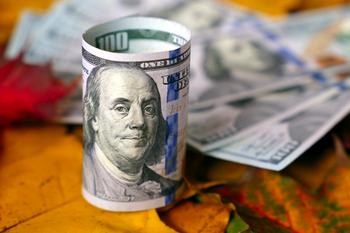 2 Top Tech Stocks to Buy in October: https://g.foolcdn.com/editorial/images/750553/roll-of-hundred-dollar-bills-on-autumn-maple-leaves.jpg