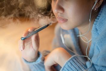 Health Advocates Target the U.S. Launch of Philip Morris' Heated Tobacco Products. Is the Stock in Trouble?: https://g.foolcdn.com/editorial/images/784023/person-wearing-headphones-using-a-vape-pen.jpg
