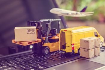 Amazon Is Ditching Plastic and Moving to Paper Fillers. Here's the Hidden Small-Cap Stock That Could Soar as a Result.: https://g.foolcdn.com/editorial/images/781242/miniature-of-yellow-van-boxes-and-pallet-truck-on-top-of-black-laptop.jpg