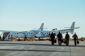 Why Virgin Galactic's Shares Collapsed Today: https://g.foolcdn.com/editorial/images/752282/virgin_galactic_pilots_on_their_way_to_the_virgin_galactic_spaceflight_system.jpg