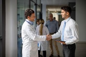 1 Reason to Buy Recursion Pharmaceuticals Stock and 2 Reasons to Sell: https://g.foolcdn.com/editorial/images/782649/physician-shaking-patients-hand.jpg