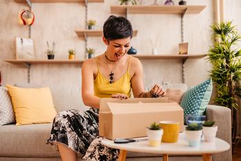 Is It Too Late to Buy Amazon Stock?: https://g.foolcdn.com/editorial/images/743634/happy-excited-opening-cardboard-box-parcel.jpg