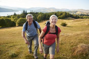 Is Phased Retirement Right for You?: https://g.foolcdn.com/editorial/images/765029/active-couple-outdoors-hiking-health-fitness.jpg