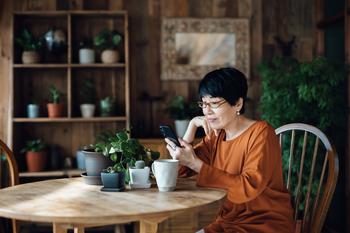 Have $100,000? Here Are 3 Ways to Grow That Money Into $1 Million for Retirement Savings.: https://g.foolcdn.com/editorial/images/777009/person-sitting-at-a-table-using-a-smartphone.jpg