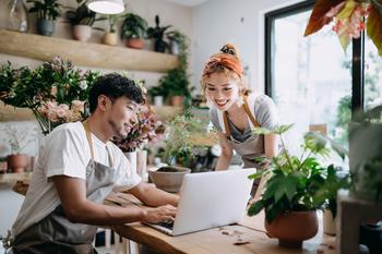 Is Shopify Stock Finally a Buy?: https://g.foolcdn.com/editorial/images/786845/2-people-looking-at-a-computer-in-a-plant-store.jpg