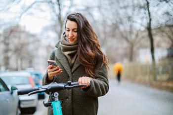 Apple Just Laid the Groundwork for Its Next Multibillion-Dollar Opportunity: https://g.foolcdn.com/editorial/images/718428/getty-images-a-commuter-checks-a-phone-while-holding-an-electric-scooter.jpg