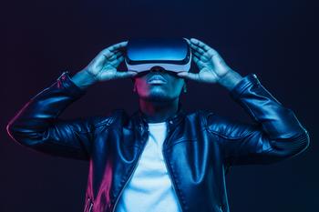 Is Unity's Partnership With Apple a Game Changer for the Stock?: https://g.foolcdn.com/editorial/images/736776/person-wearing-a-virtual-reality-headset-to-view-the-metaverse.jpg