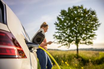 Why Wolfspeed Skyrocketed Today: https://g.foolcdn.com/editorial/images/738684/driver-uses-a-smart-phone-while-charging-an-electric-vehicle.jpg