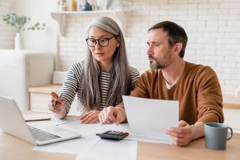 Spousal Social Security: 3 Rules All Married Couples Need to Know Before Retirement: https://g.foolcdn.com/editorial/images/771258/two-people-with-serious-expressions-looking-at-a-laptop.jpg