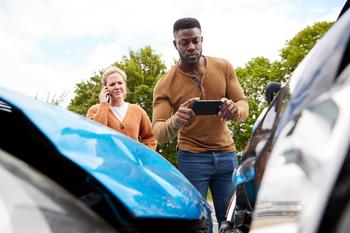 Can Lemonade Use Insurance Customer's Frustrations This to Gain Market Share?: https://g.foolcdn.com/editorial/images/715614/auto-insurance-damage-car-crash-man-woman-taking-pictures.jpg