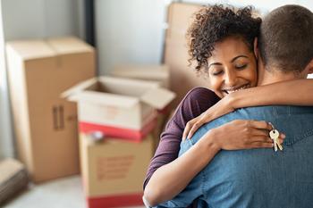 Fed Rate Cut: 2 Growth Stocks to Buy Right Now: https://g.foolcdn.com/editorial/images/791249/two-people-hugging-one-holding-new-house-keys-in-front-of-moving-boxes.jpg