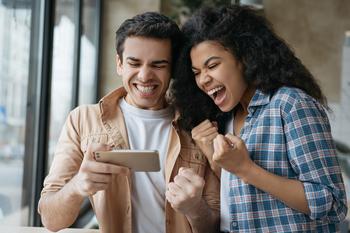 Looking for Growth and Dividends? Try These 2 Top "Magnificent Seven" Stocks: https://g.foolcdn.com/editorial/images/767907/gettyimages-investors-or-sports-betting_excited.jpg