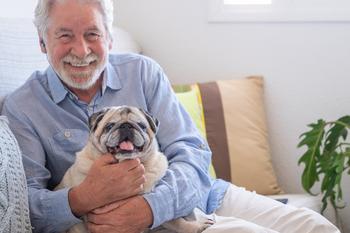 3 Positive Changes Seniors on Social Security Can Look Forward to in 2024: https://g.foolcdn.com/editorial/images/751064/smiling-person-holding-dog_gettyimages-1326614891.jpg