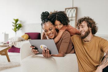 3 Things About Amazon That Smart Investors Know: https://g.foolcdn.com/editorial/images/746464/smiling-parents-and-daughter-at-home-watching-online-movie-together.jpg