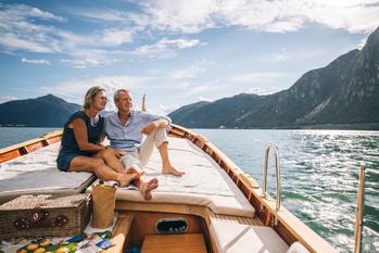 Better Buy: MarineMax vs. Marine Products Stock: https://g.foolcdn.com/editorial/images/736214/vacation-older-couple-travel-boat-mountains.jpg