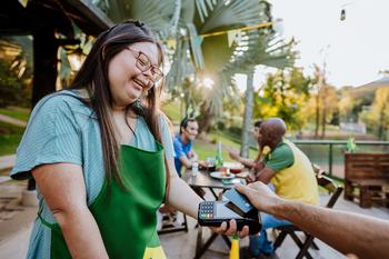 Warren Buffett Now Has $1.3 Billion Invested in This Consumer Finance Company: https://g.foolcdn.com/editorial/images/746212/person-takes-payment-at-coffee-shop-getty-2022.jpg