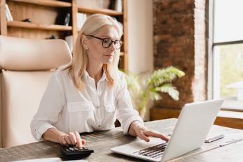 Here's What Happens When You Don't Sign Up for Medicare On Time: https://g.foolcdn.com/editorial/images/778187/older-woman-laptop-gettyimages-1352069183.jpg
