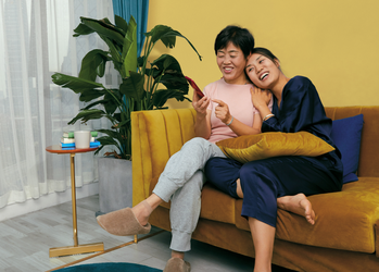 Can Alibaba Stock Return to Its Past Glory?: https://g.foolcdn.com/editorial/images/743013/smiling-people-on-couch-shop-online-in-china-source-pinduoduo.png