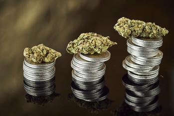 Better Growth Stock: Curaleaf Holdings vs. Green Thumb Industries: https://g.foolcdn.com/editorial/images/734346/cannabis-stacked-on-coins.jpeg