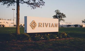 Why Rivian Plunged Almost 43% in the First Half of 2024: https://g.foolcdn.com/editorial/images/783560/building-with-_rivian-logo-sign-on-front-lawn_rivian.jpg