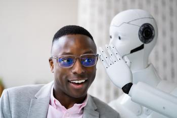 2 AI Stocks Wall Street Loves: https://g.foolcdn.com/editorial/images/740357/ai-robot-whispers-secrets-to-smiling-human.jpg