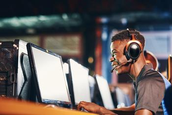 Here's Why Nvidia and AMD Are Set to Skyrocket in 2024: https://g.foolcdn.com/editorial/images/759440/man-wearing-headphones-and-looking-at-a-computer.jpg